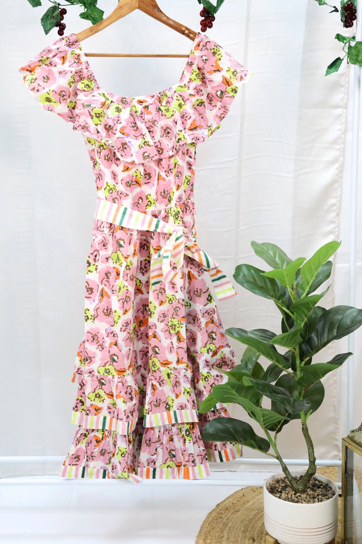 Pink floral blockprint dress on hanger