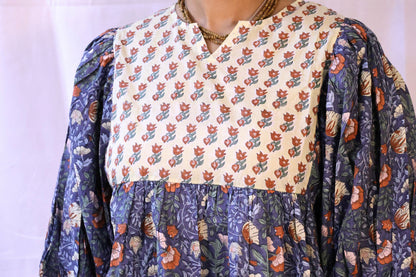 Blue bohemian top with puffy sleeves and hand blockprinted patterns closeup.
