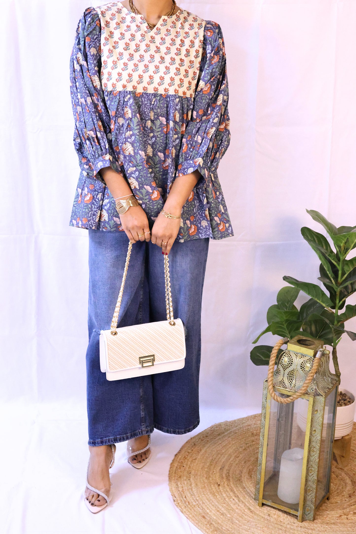Blue bohemian top with puffy sleeves and hand blockprinted patterns.
