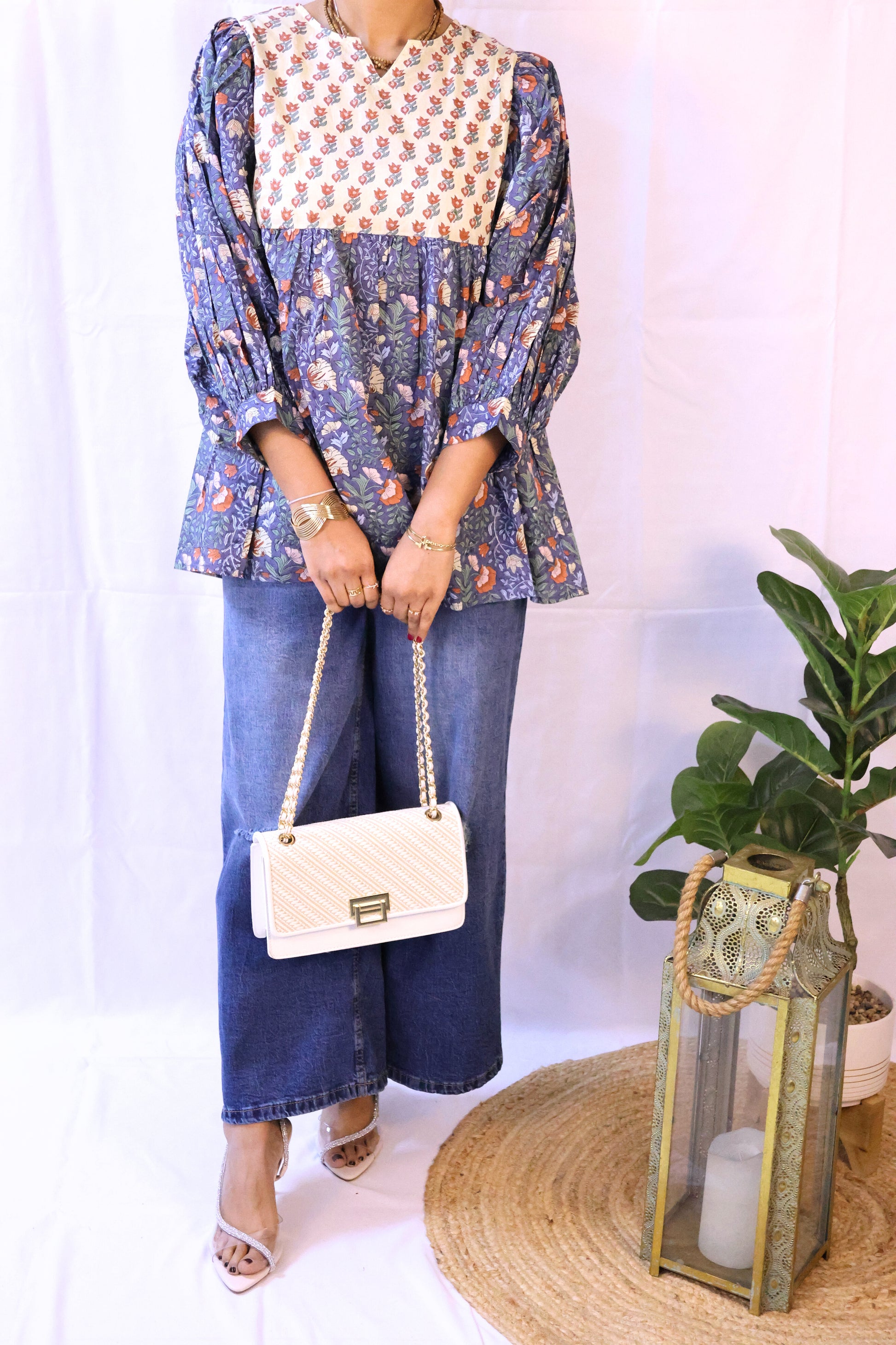 Blue bohemian top with puffy sleeves and hand blockprinted patterns.