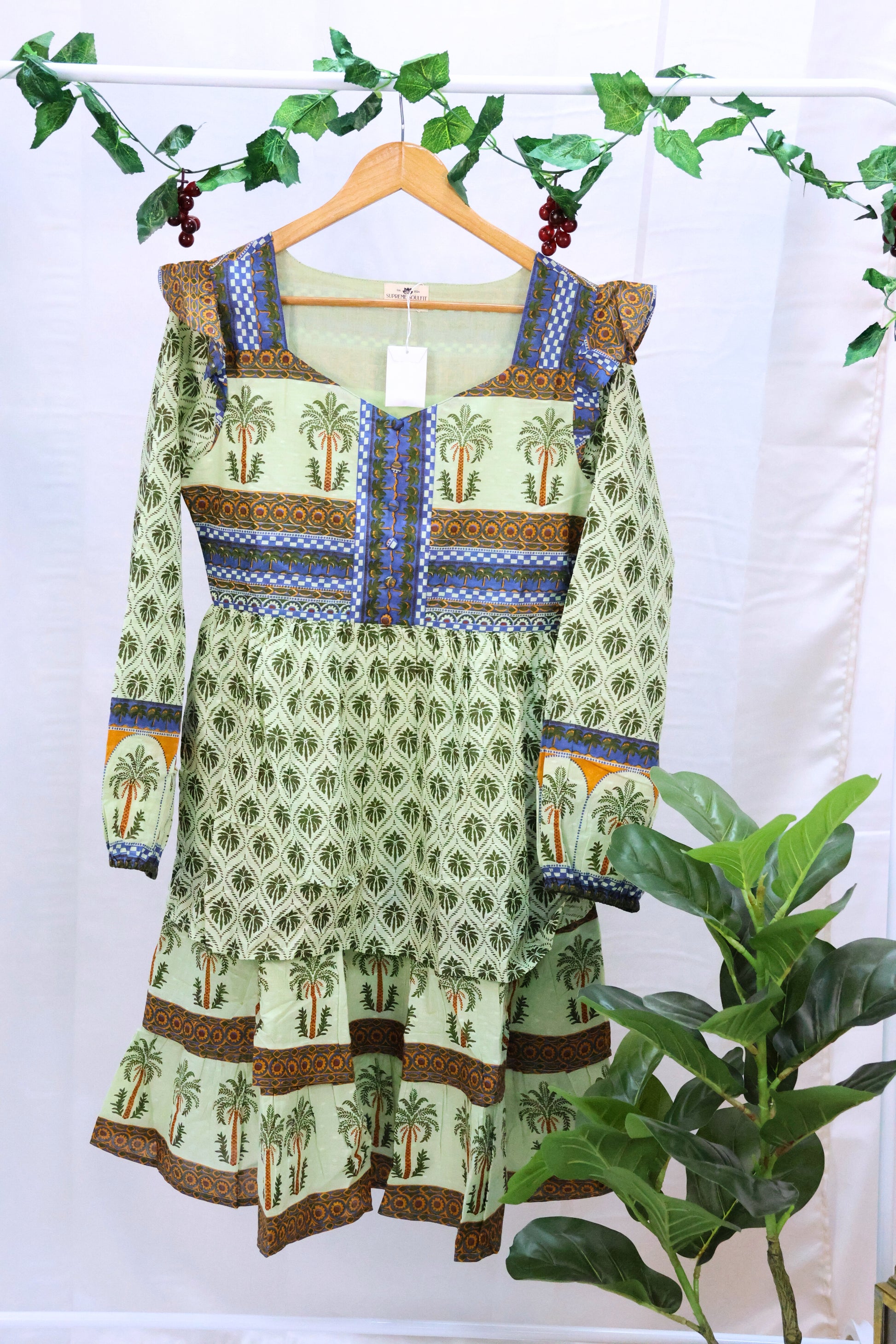 Green blockprinted dress on hanger