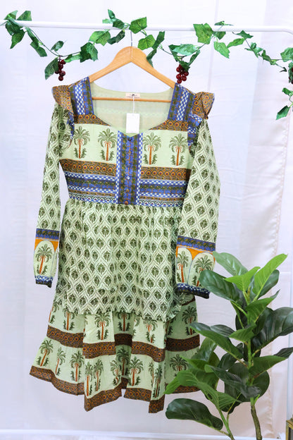 Green blockprinted dress on hanger