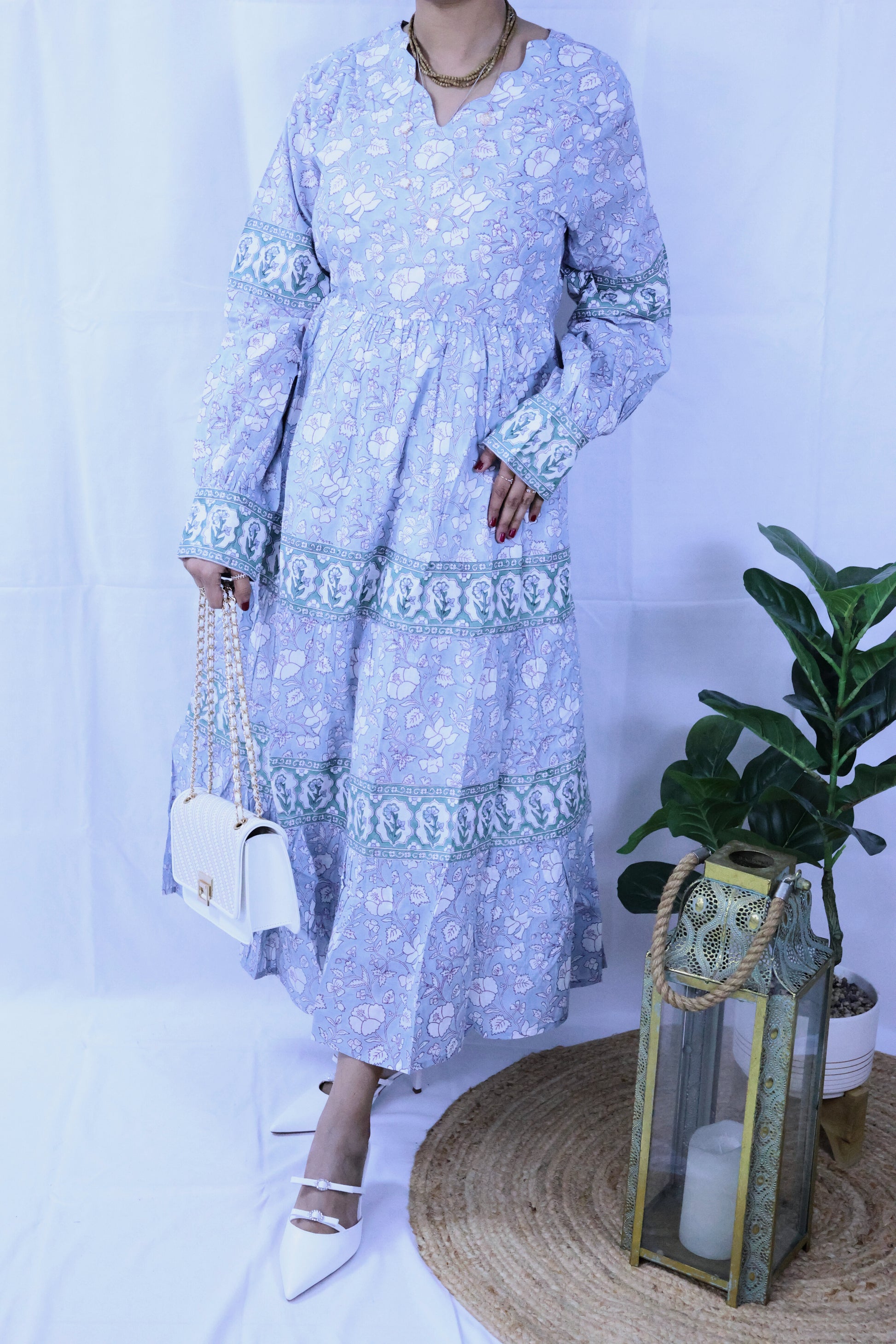 Light blue floor length blockprint dress with long sleeves.