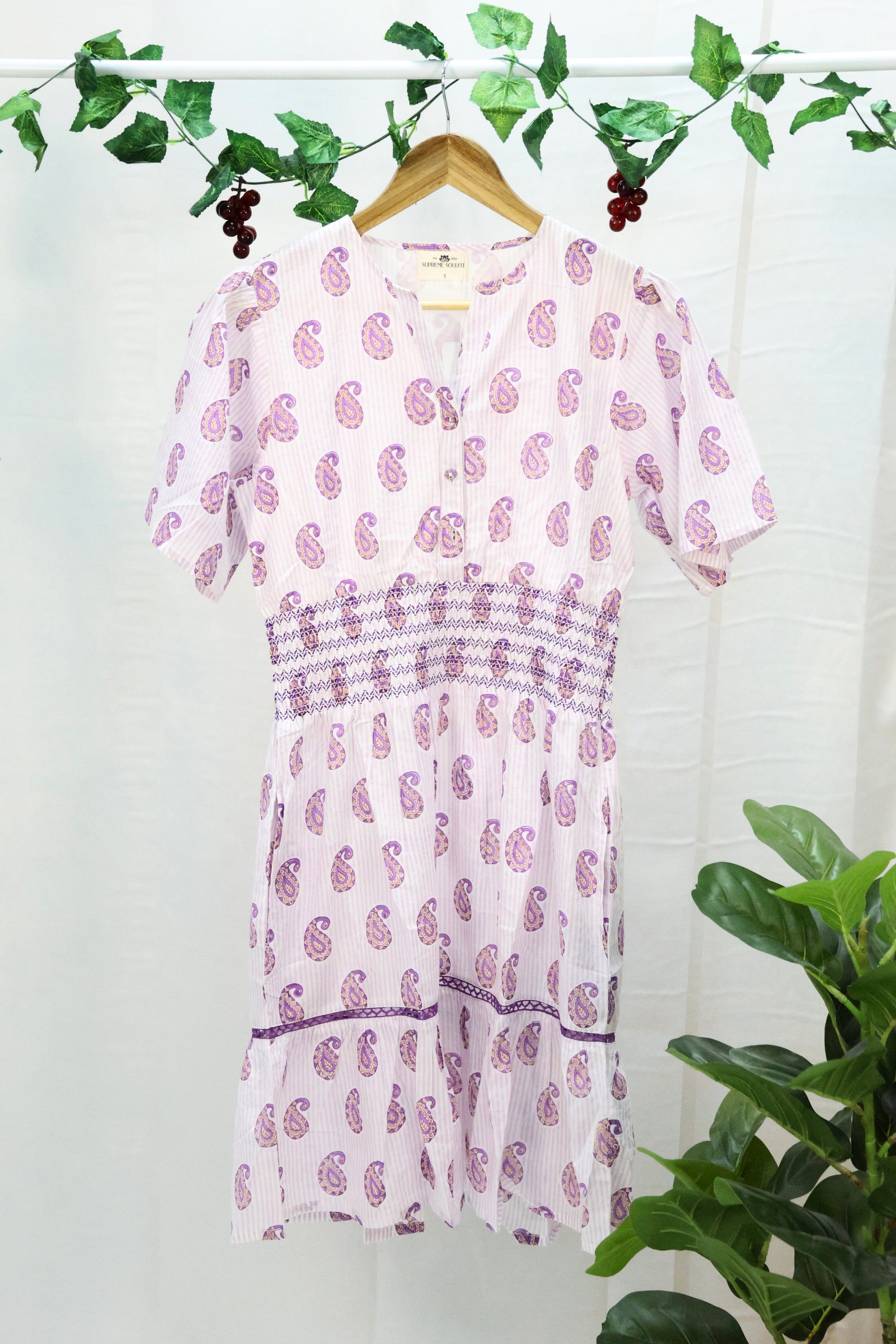 white base lavender blockprint dress  on hanger.